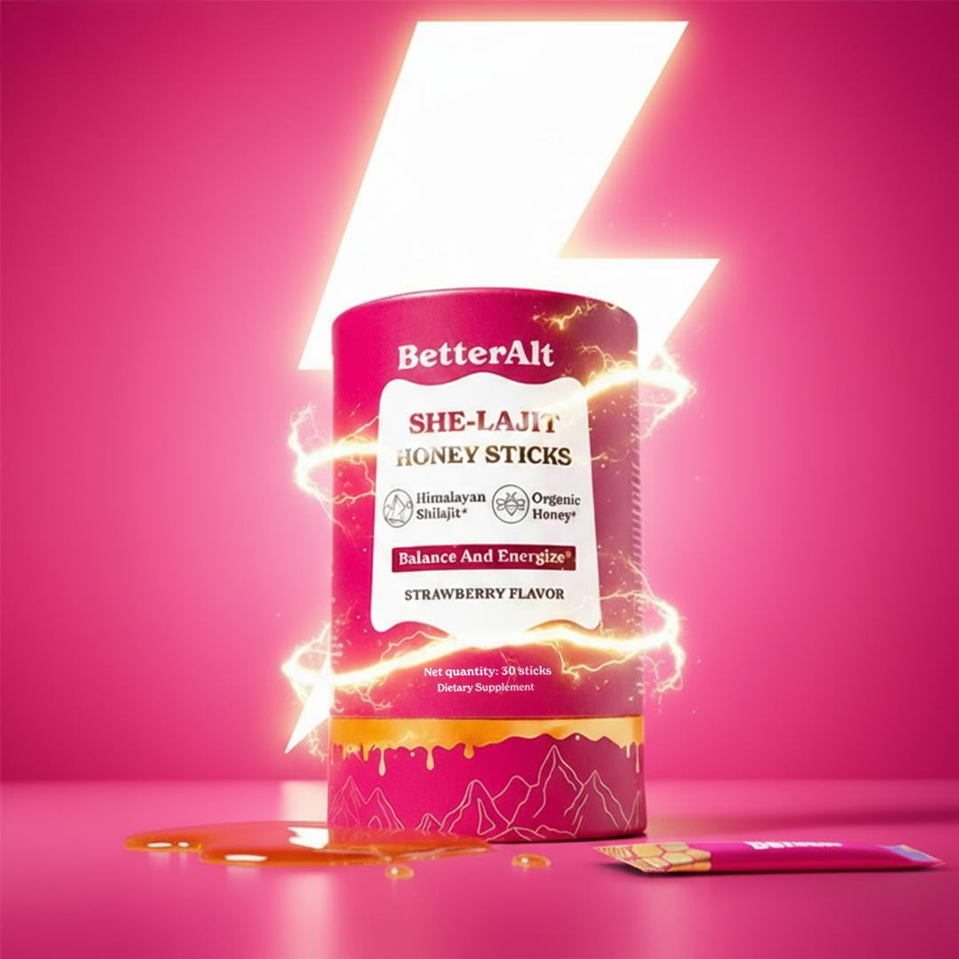 Pink container of BetterAlt She-Lajit Honey Sticks with strawberry flavor on bright pink background.