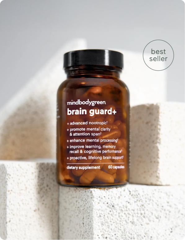 Brown bottle of brain guard+ capsules on white blocks, labeled 'best seller.'