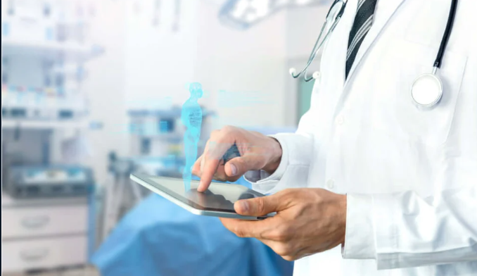 Doctor using a tablet with a holographic display in a medical setting.