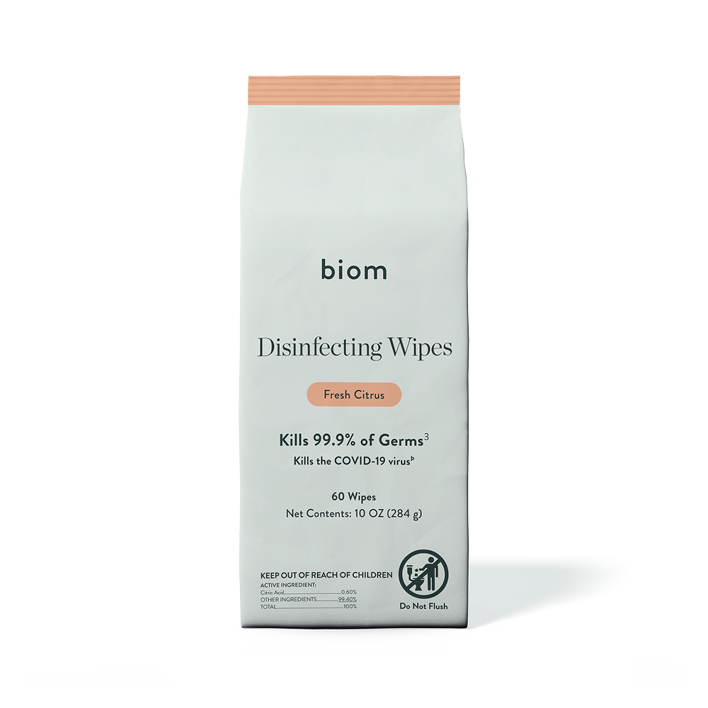 A white pouch of biom Fresh Citrus Disinfecting Wipes against a black background.