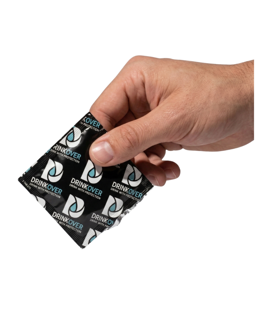 A hand holding a black foil packet of Drinkover tablets against a white background.