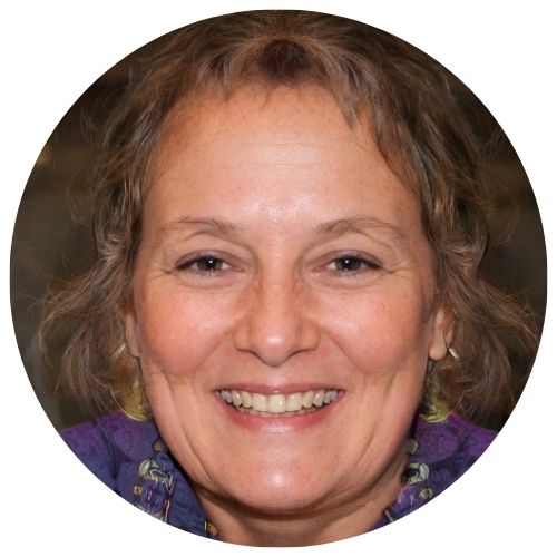 Smiling person with short, brown hair on a circular background.