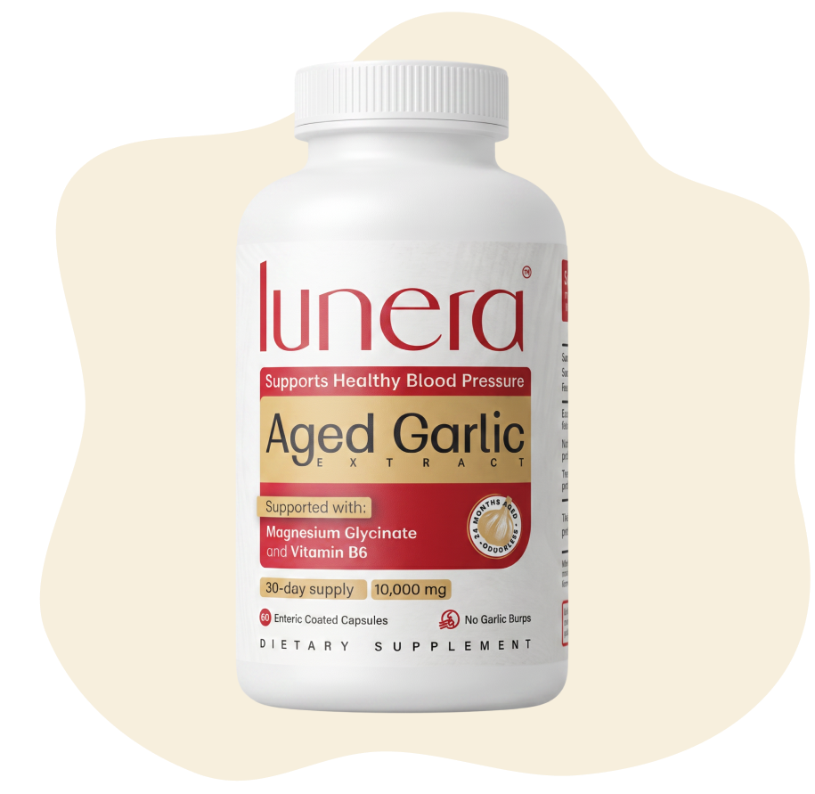 A white bottle of Lunera Aged Garlic Extract dietary supplement against a cream-colored, stylized background.
