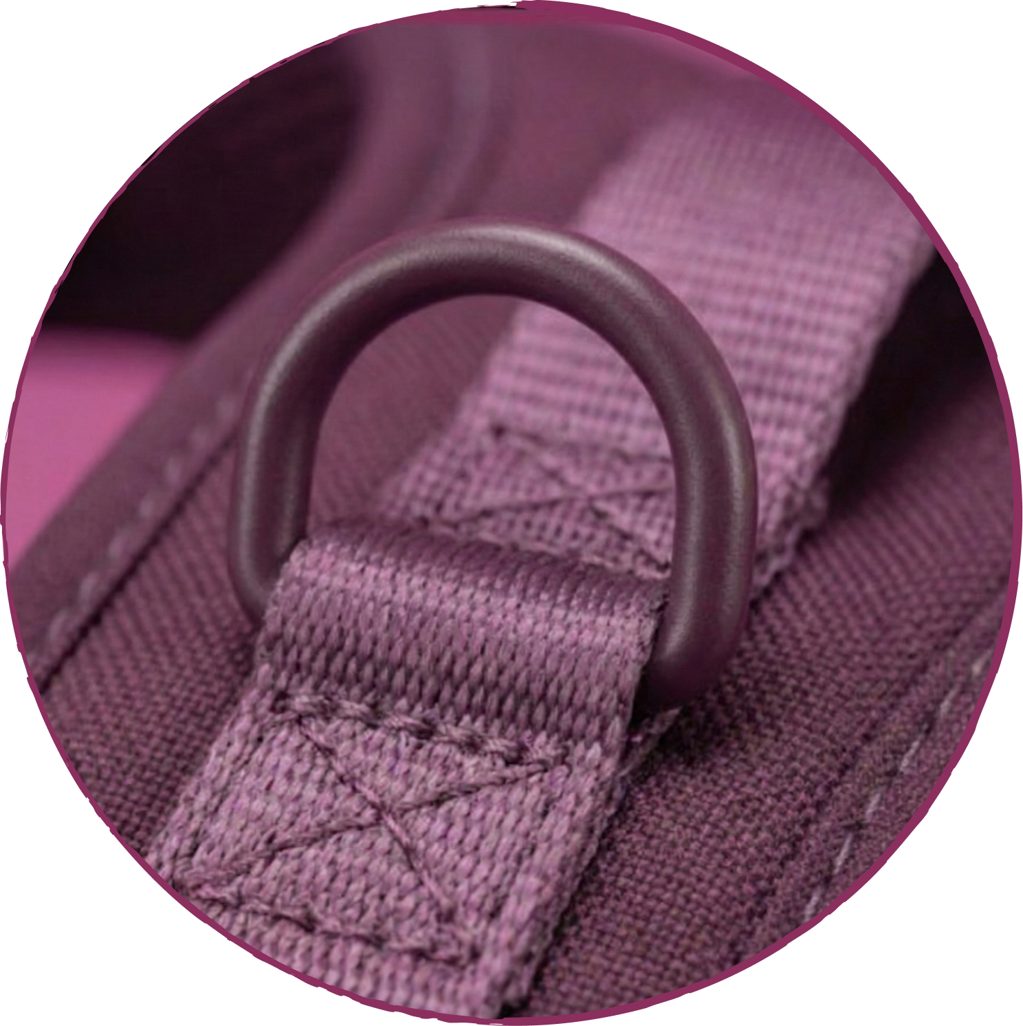 A close-up of a purple D-ring attached to a purple strap with reinforced stitching on a fabric product.