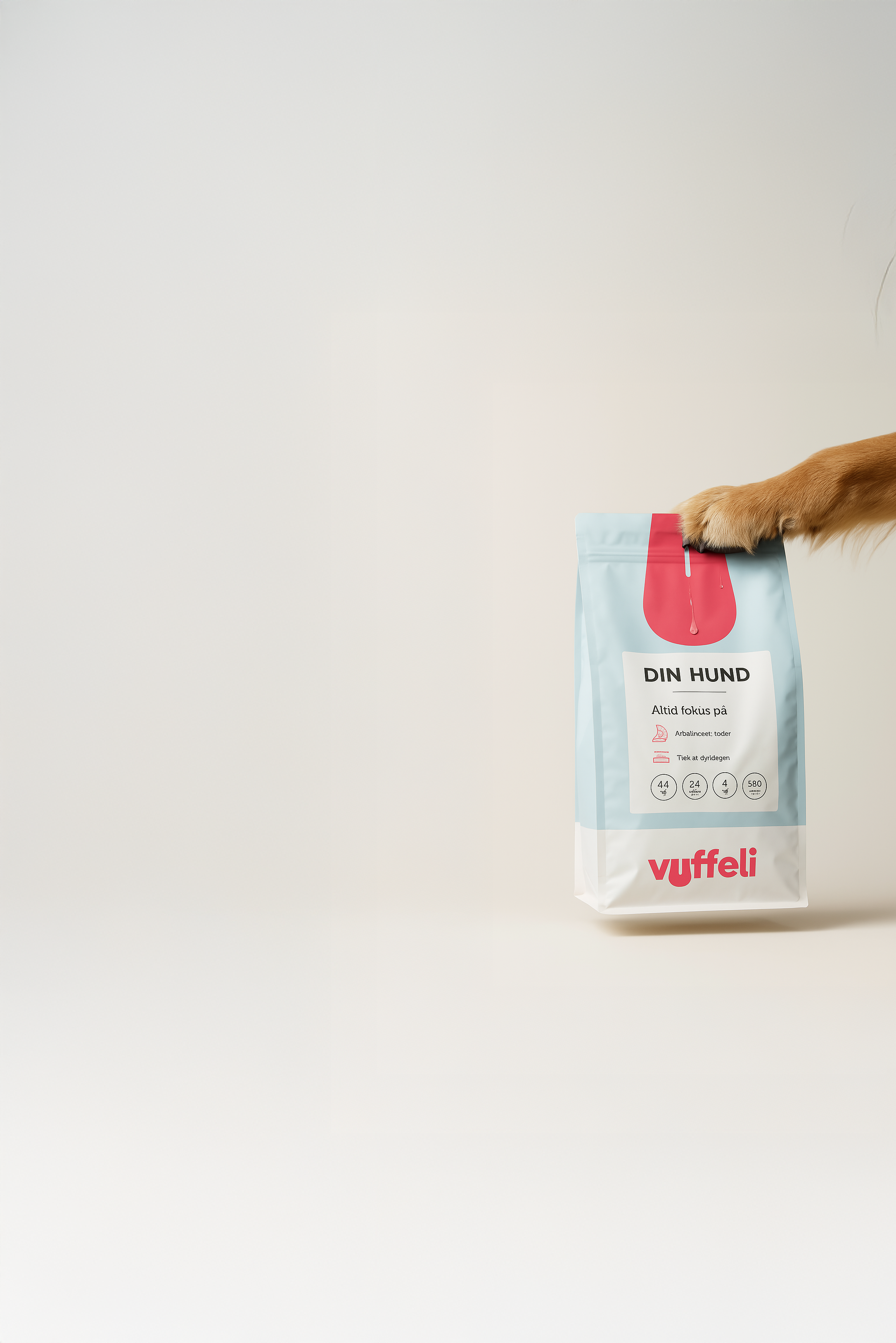 Dog paw holding a blue and white bag labeled 'DIN HUND' with a pink logo.