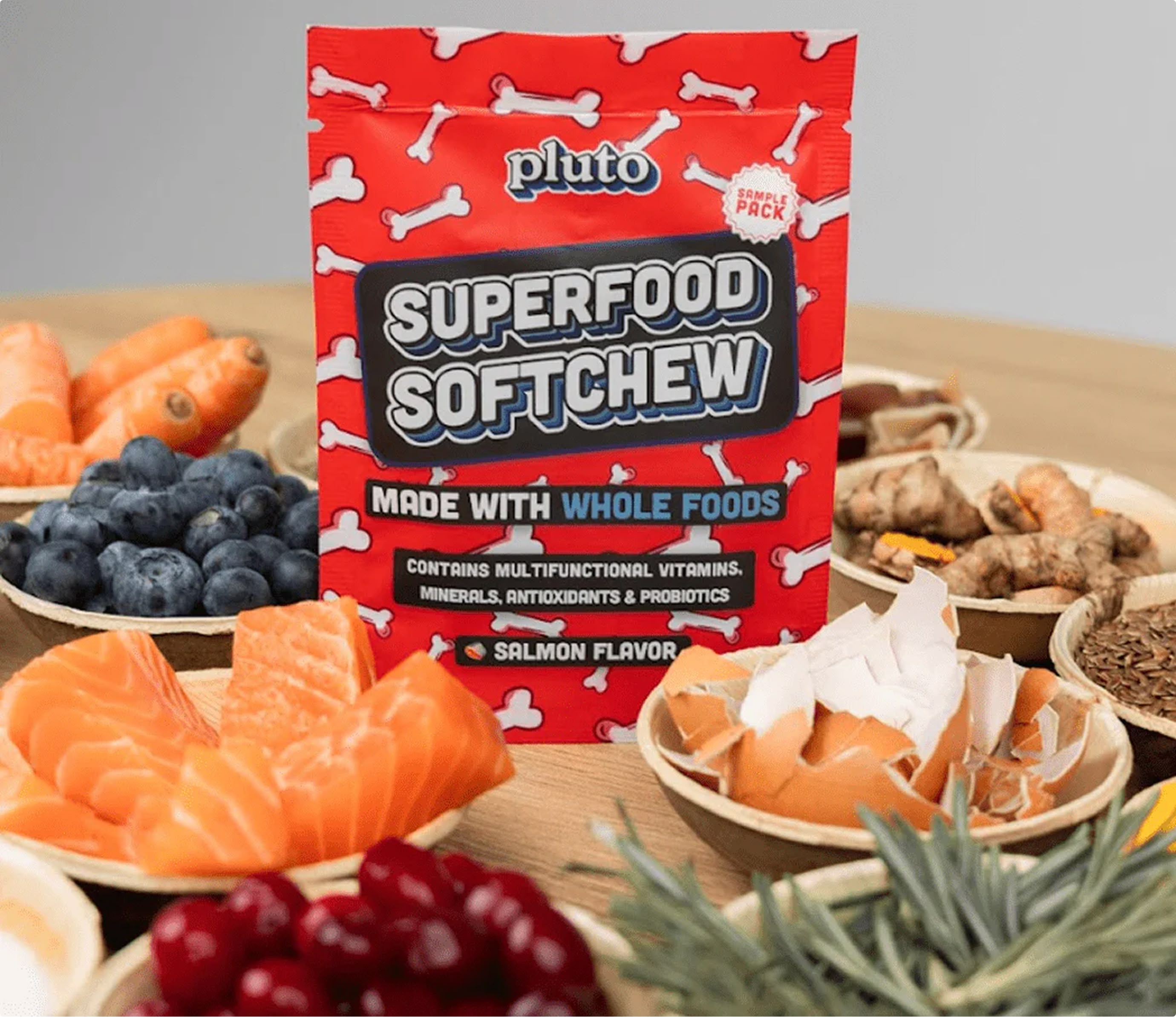 Red bag of Superfood Softchew with various whole foods around it.