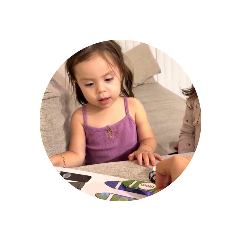 Child smiling with educational toy