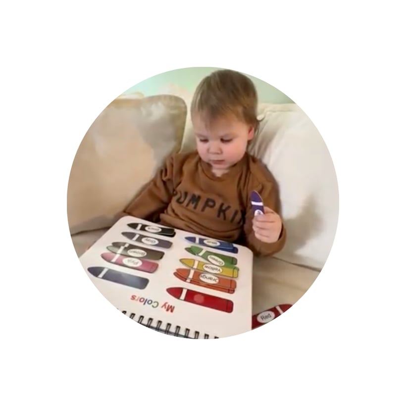 Child smiling with learning activity