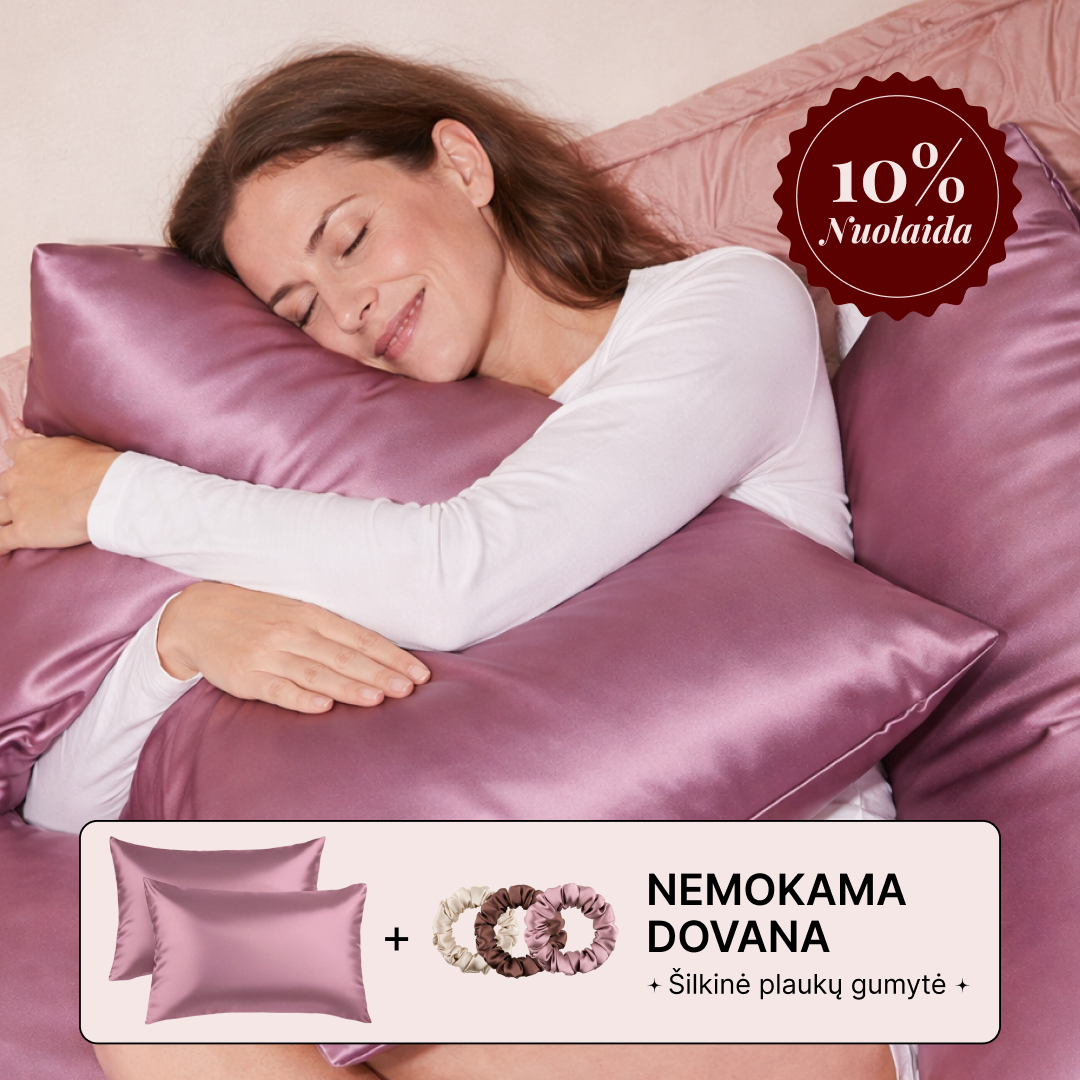A smiling woman in a white long-sleeved shirt sleeps peacefully while hugging a shiny purple pillow.