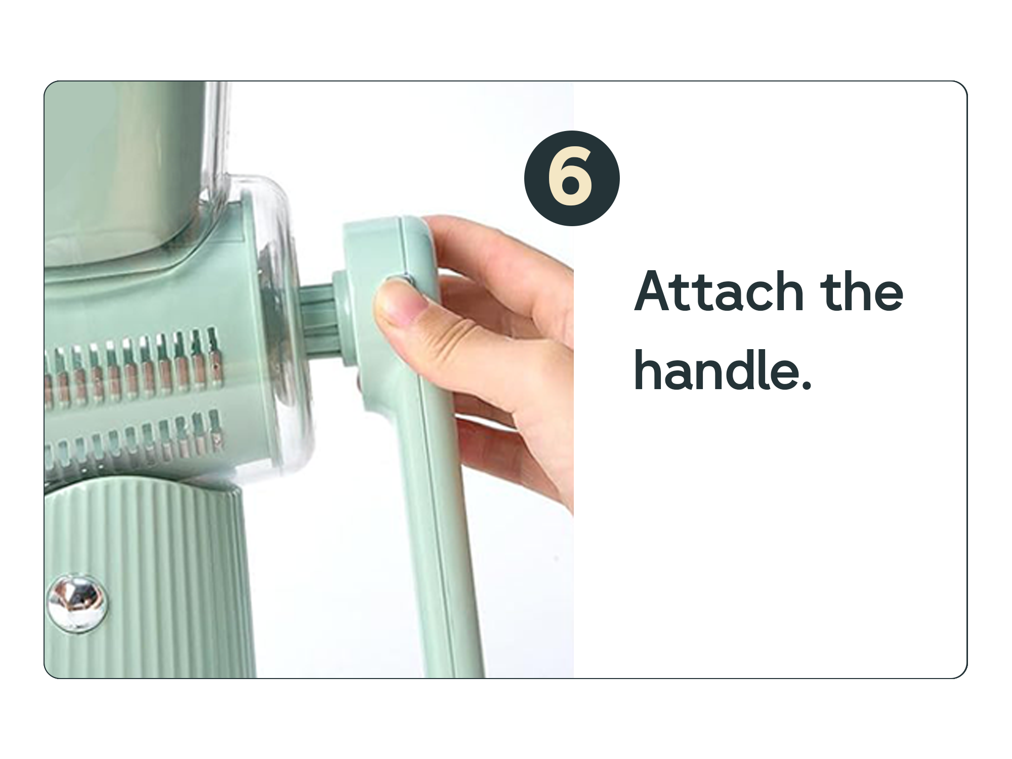 Hand attaching a handle to a light green kitchen appliance.