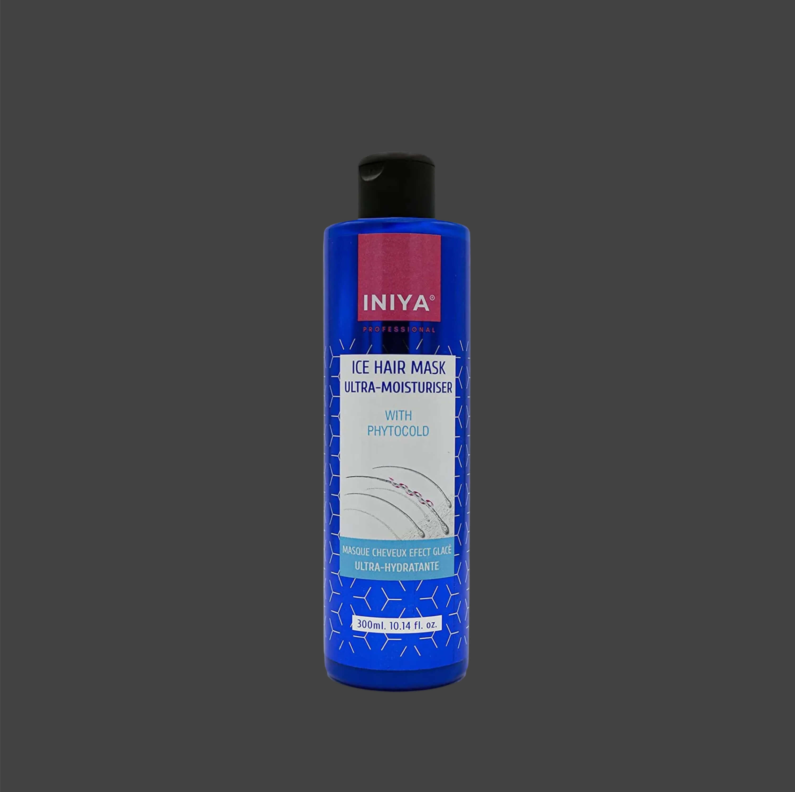 Blue bottle of Iniya ice hair mask on gray background.