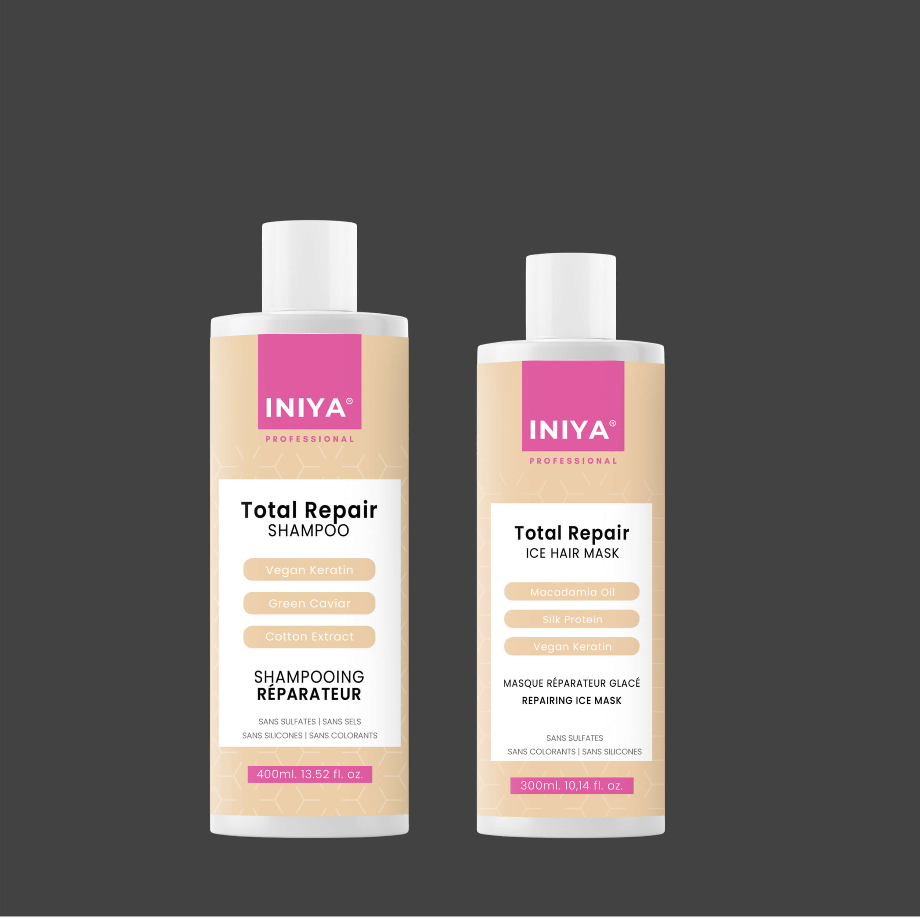 Two bottles of INIYA Total Repair hair products with pink labels.
