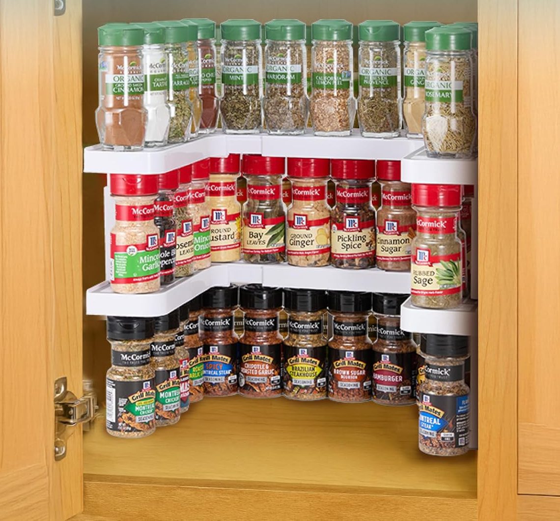Two Spicy Shelf Premium shelves stacked in a cabinet full of spices