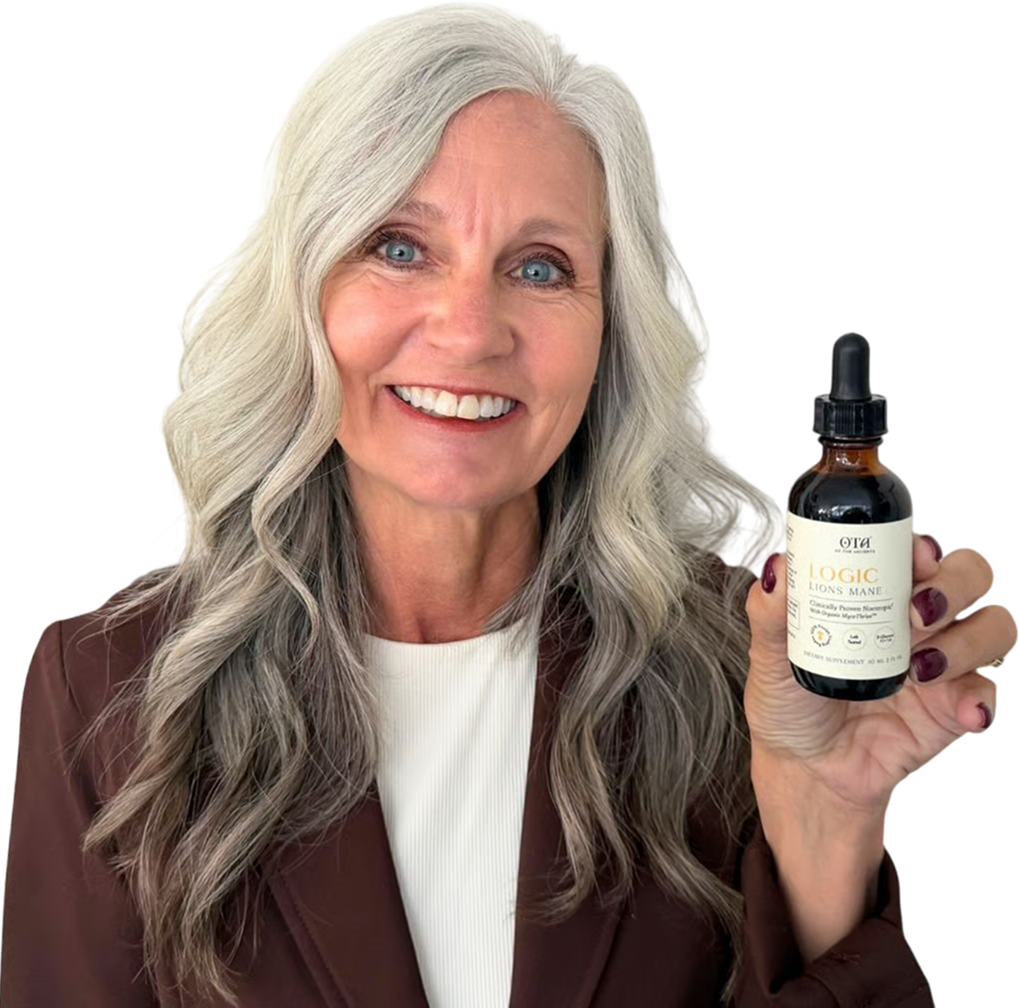 A smiling woman in a bathrobe holds up a small brown bottle with a dropper.