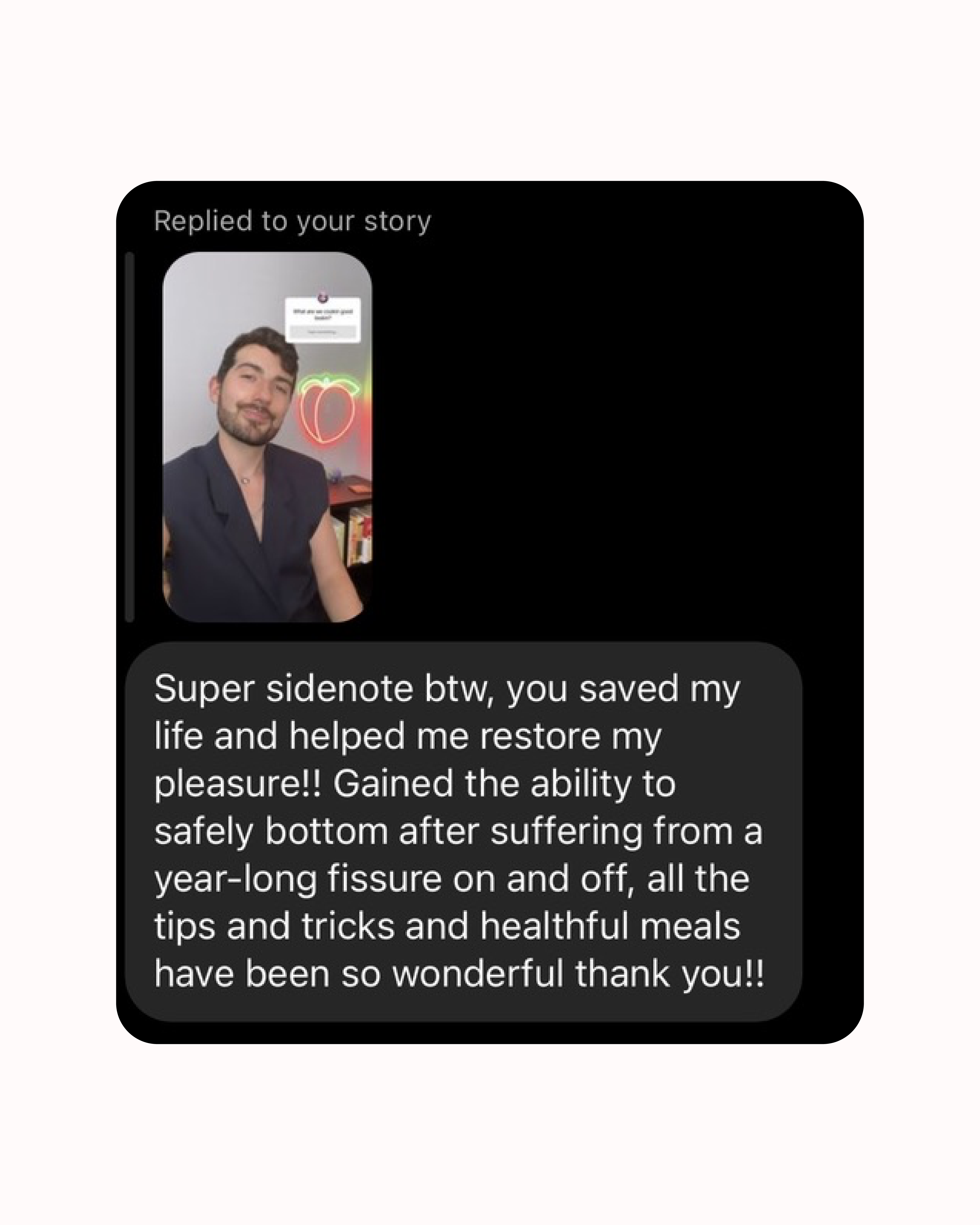 Screenshot of a message reply with a photo of a person and a neon heart sign.