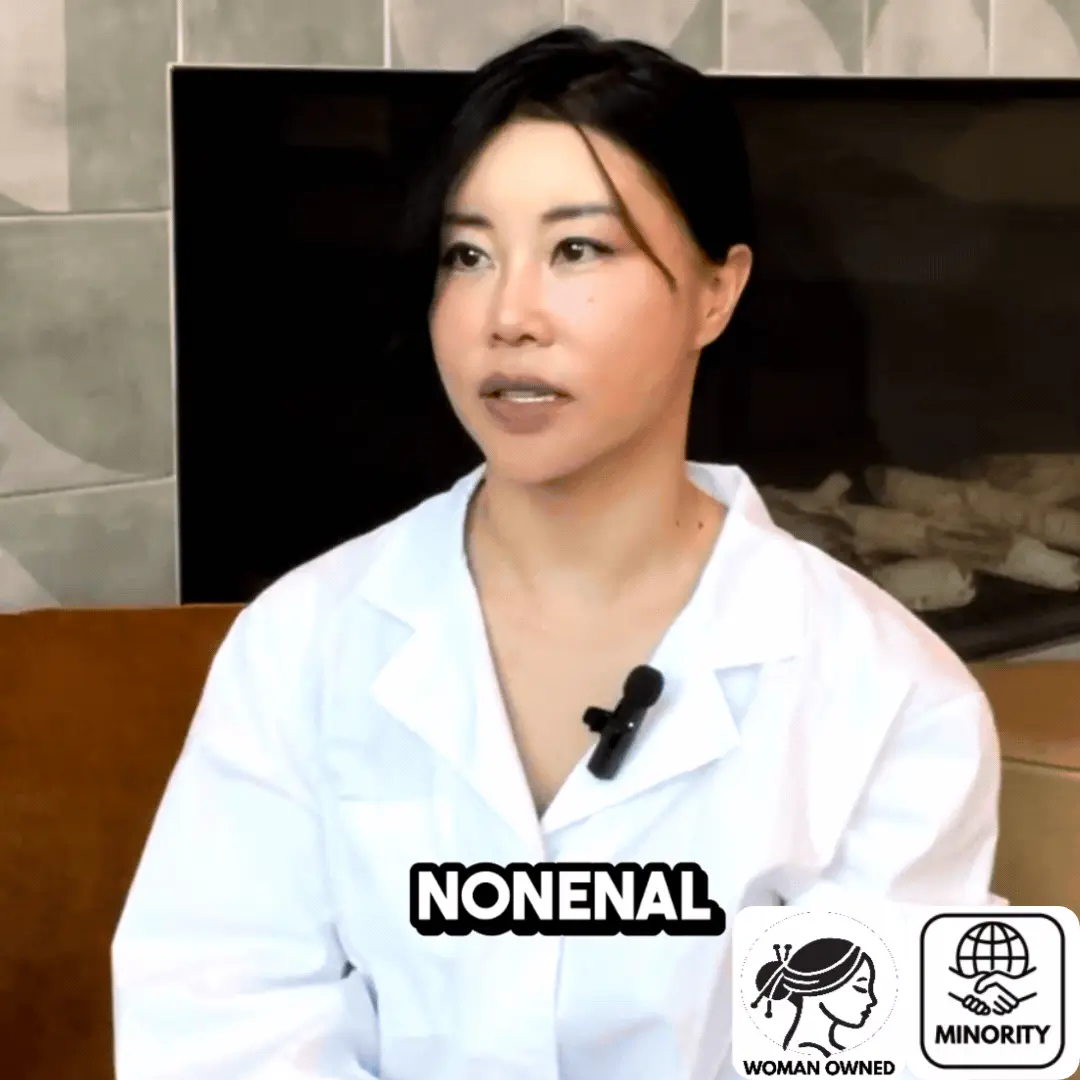 A woman in a white coat with a lavalier microphone speaks, with text and icons overlaid on the image.