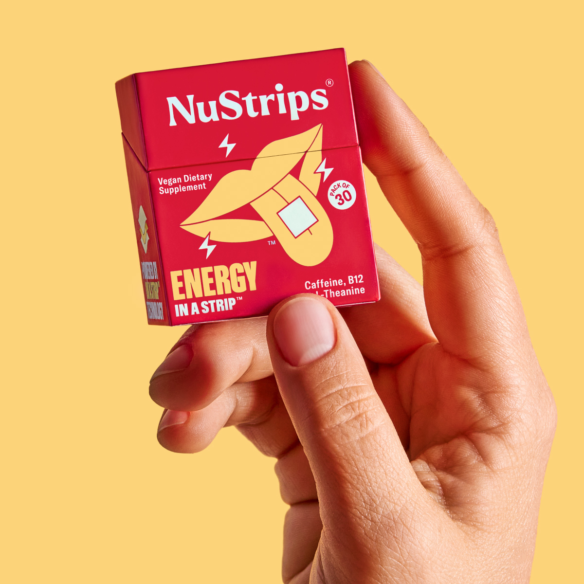 Hand holding a red box labeled 'NuStrips Energy in a Strip.'