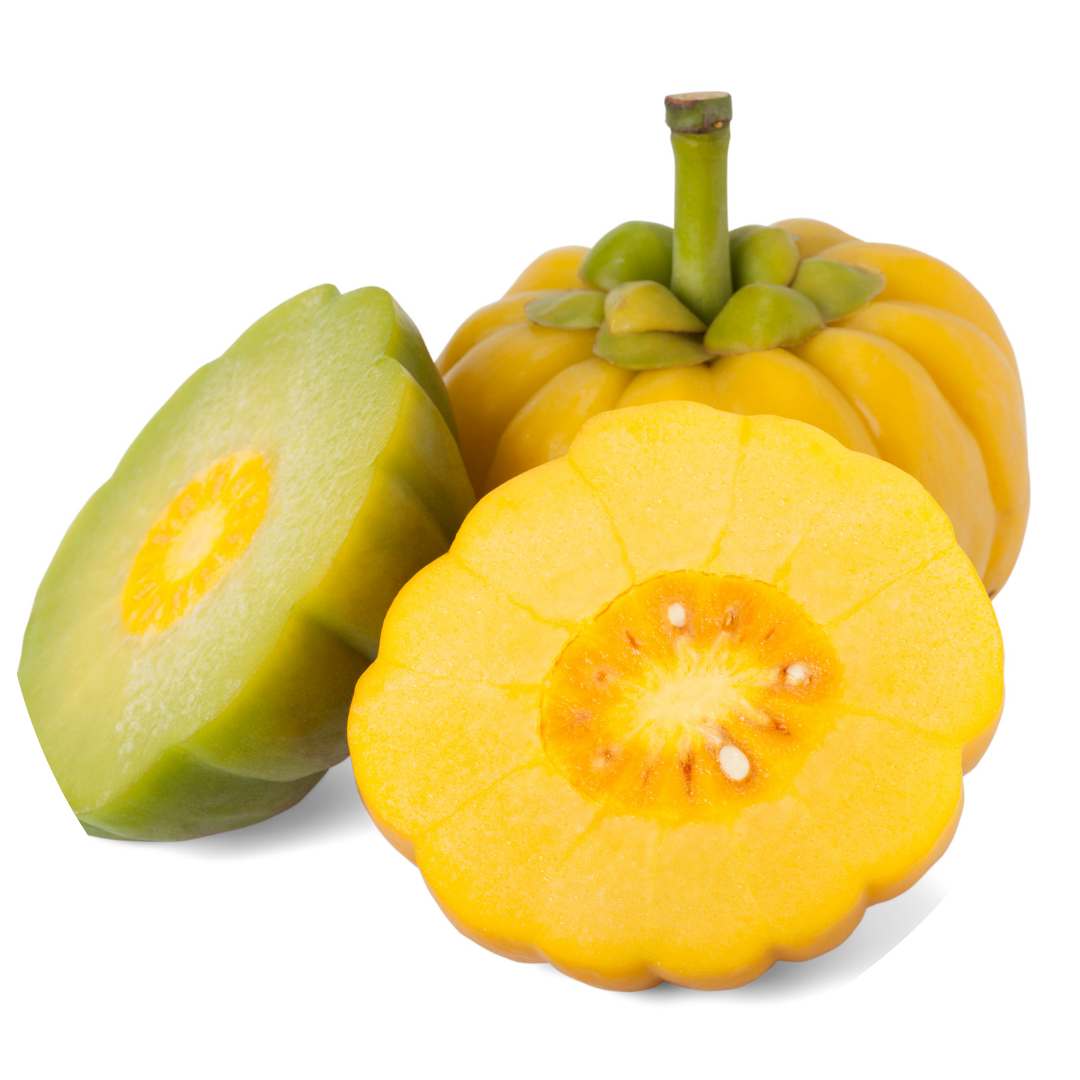 Whole and sliced yellow fruit with greenish interior on white background.
