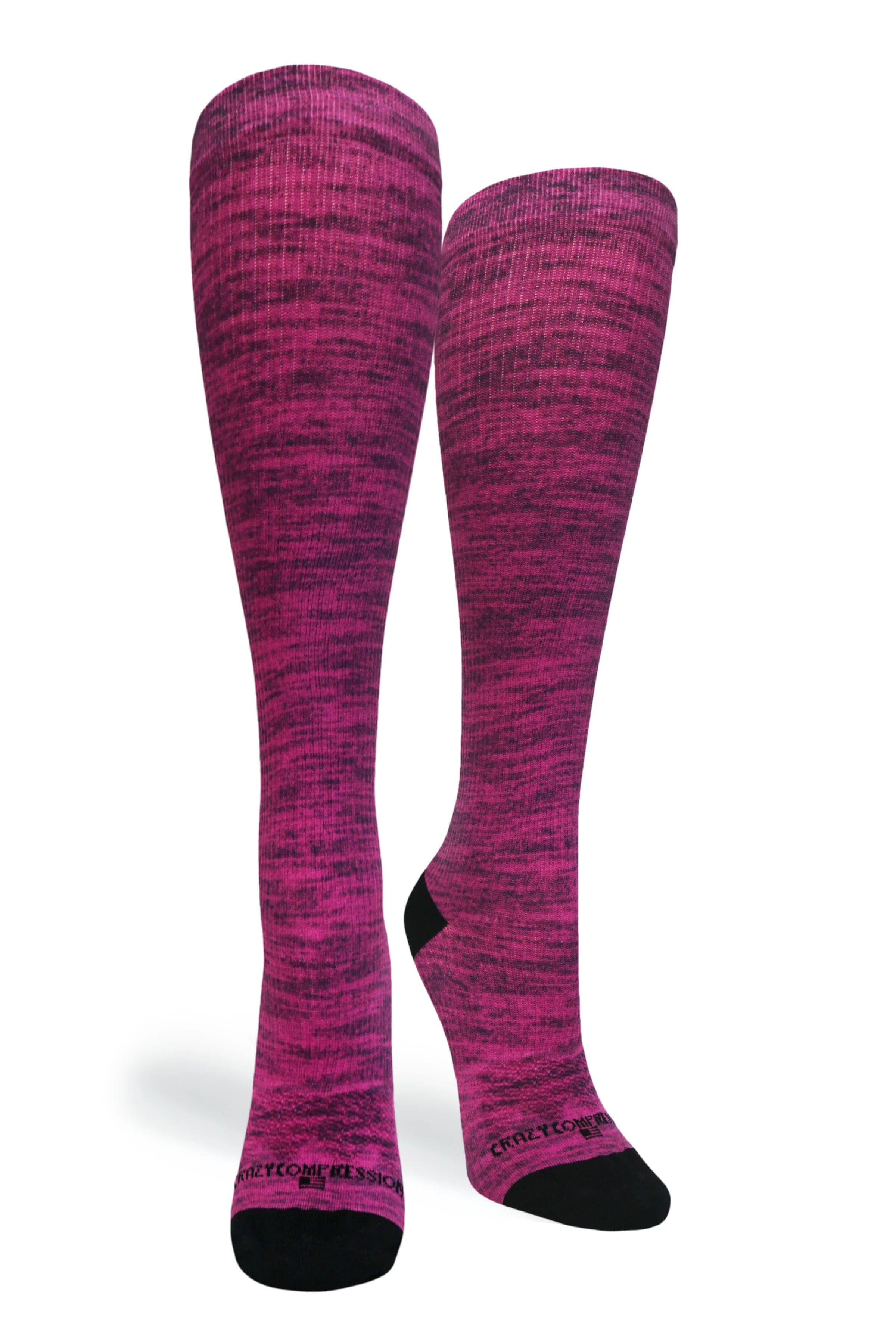 A pair of magenta and black marled knee-high compression socks with black heels and toes.
