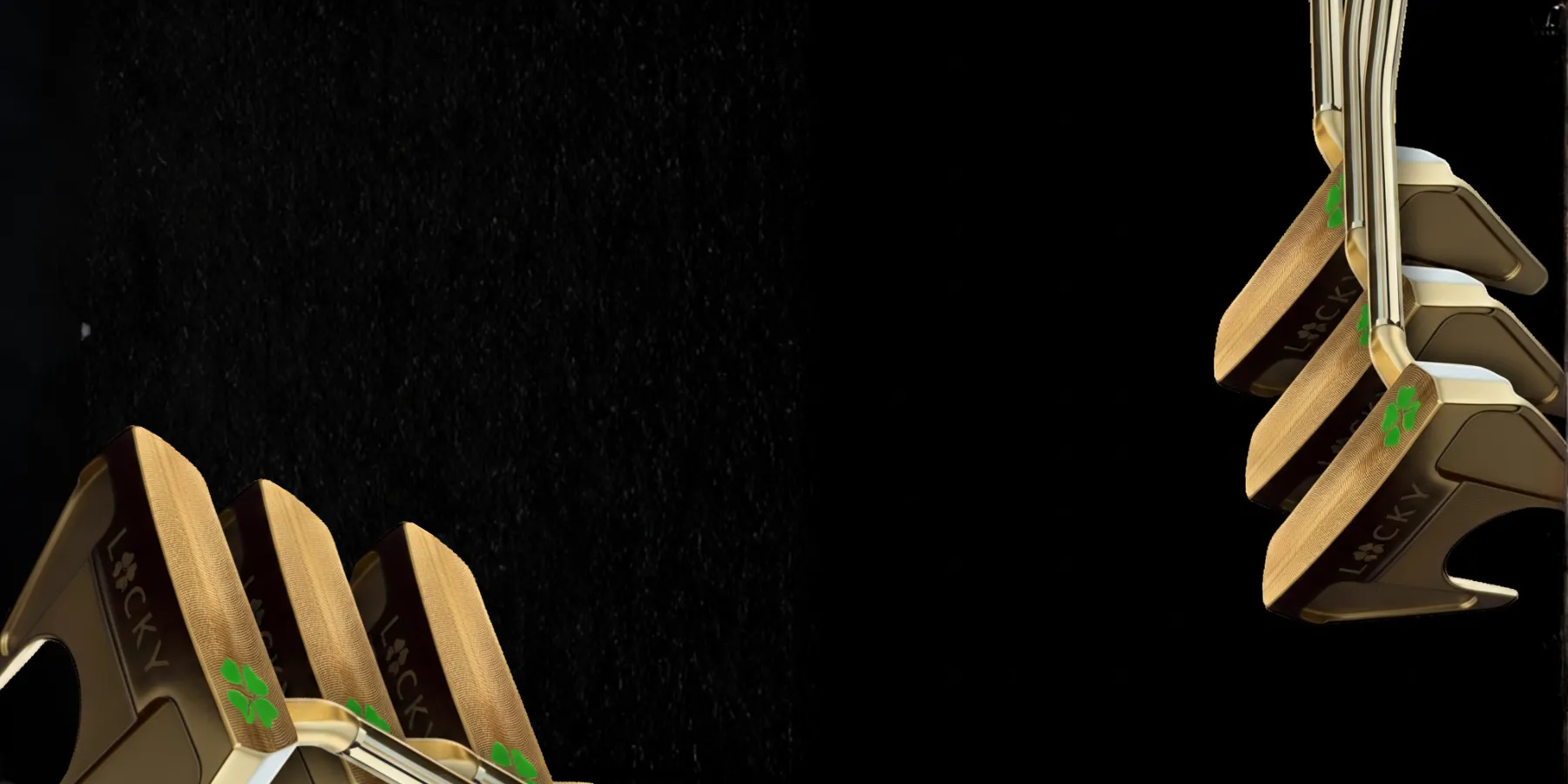 Gold putter heads with green clovers on a black background.