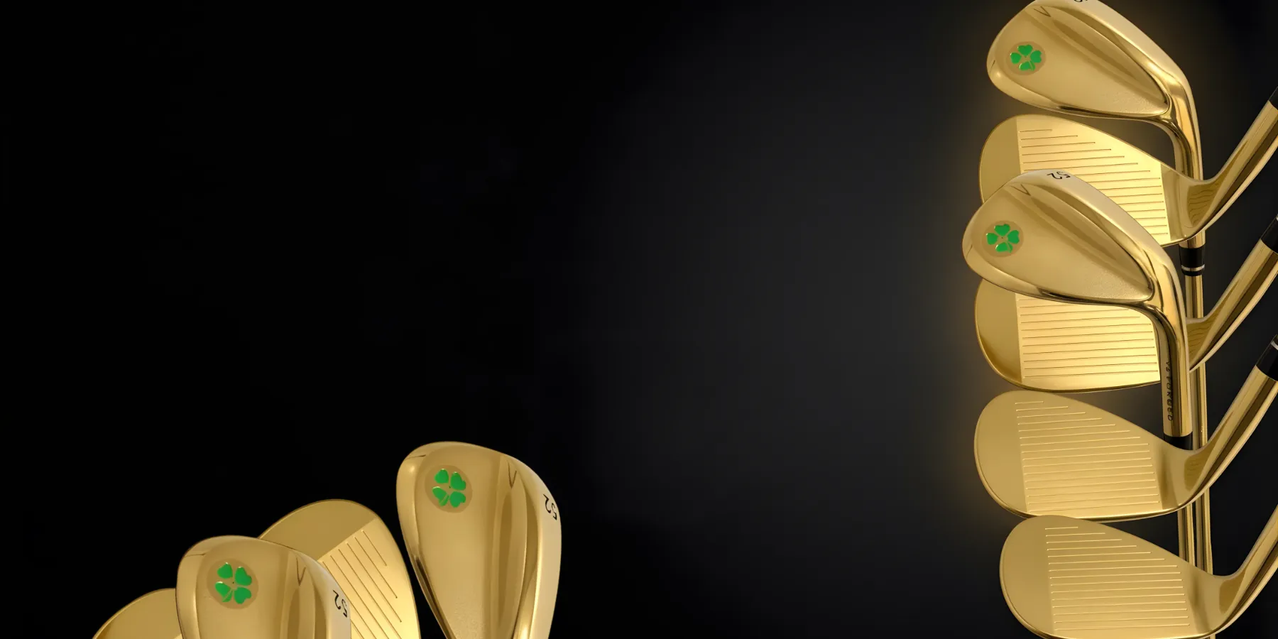 Gold golf clubs with green clover design on black background.