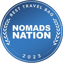 Blue circular badge with 'Best Travel Bag Nomads Nation 2023' text.