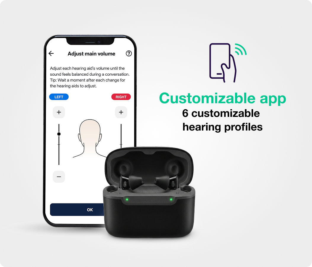 A smartphone displaying a hearing aid control app next to a pair of hearing aids in their case.