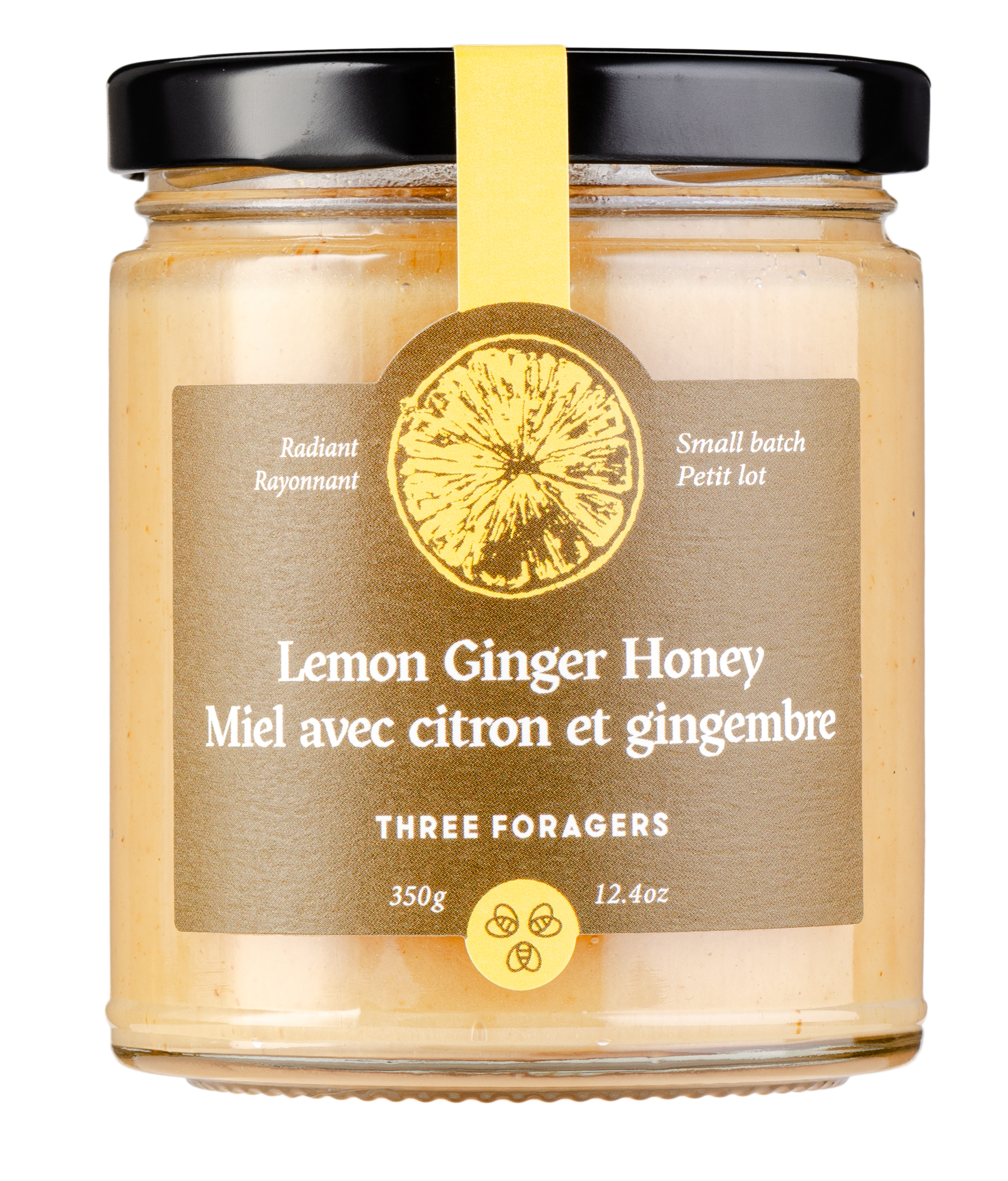 Jar of Lemon Ginger Honey with a black lid and yellow label.
