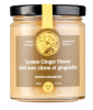 Jar of lemon ginger honey with a black lid and yellow label.