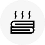 Icon of steaming books on a white circular background.