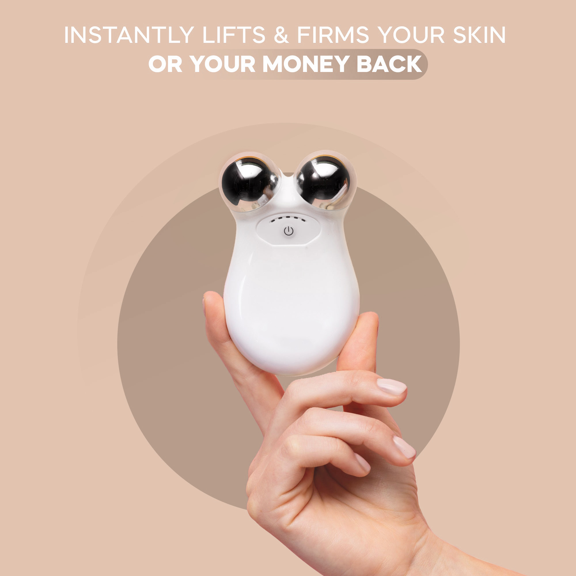 Hand holding a white skincare device with metallic spheres.