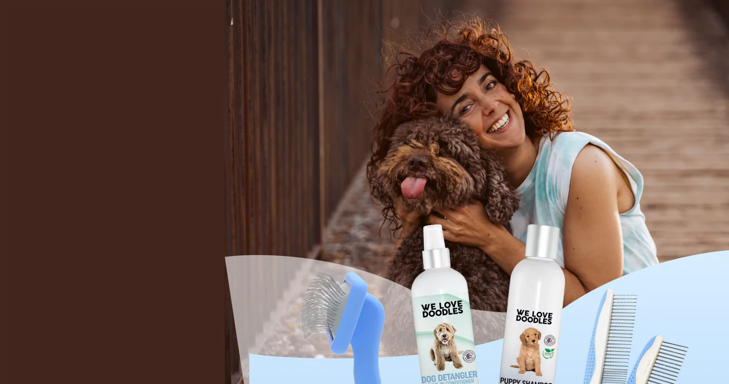 Woman smiling with a fluffy dog, grooming products in foreground.