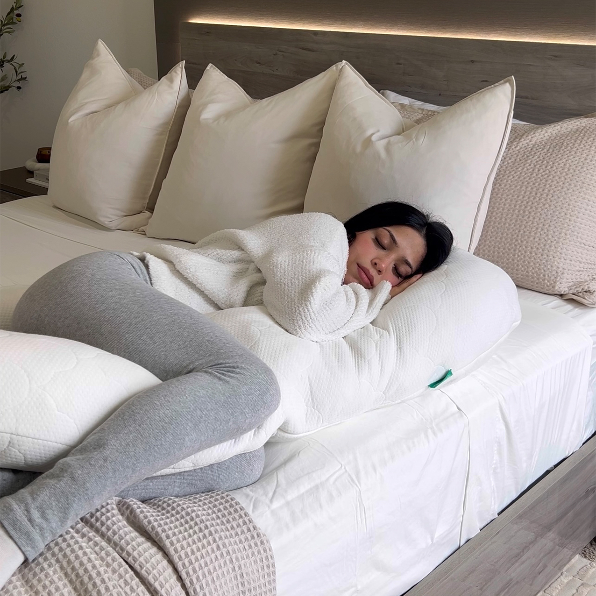 Woman sleeping with The Newton Pillow in bed