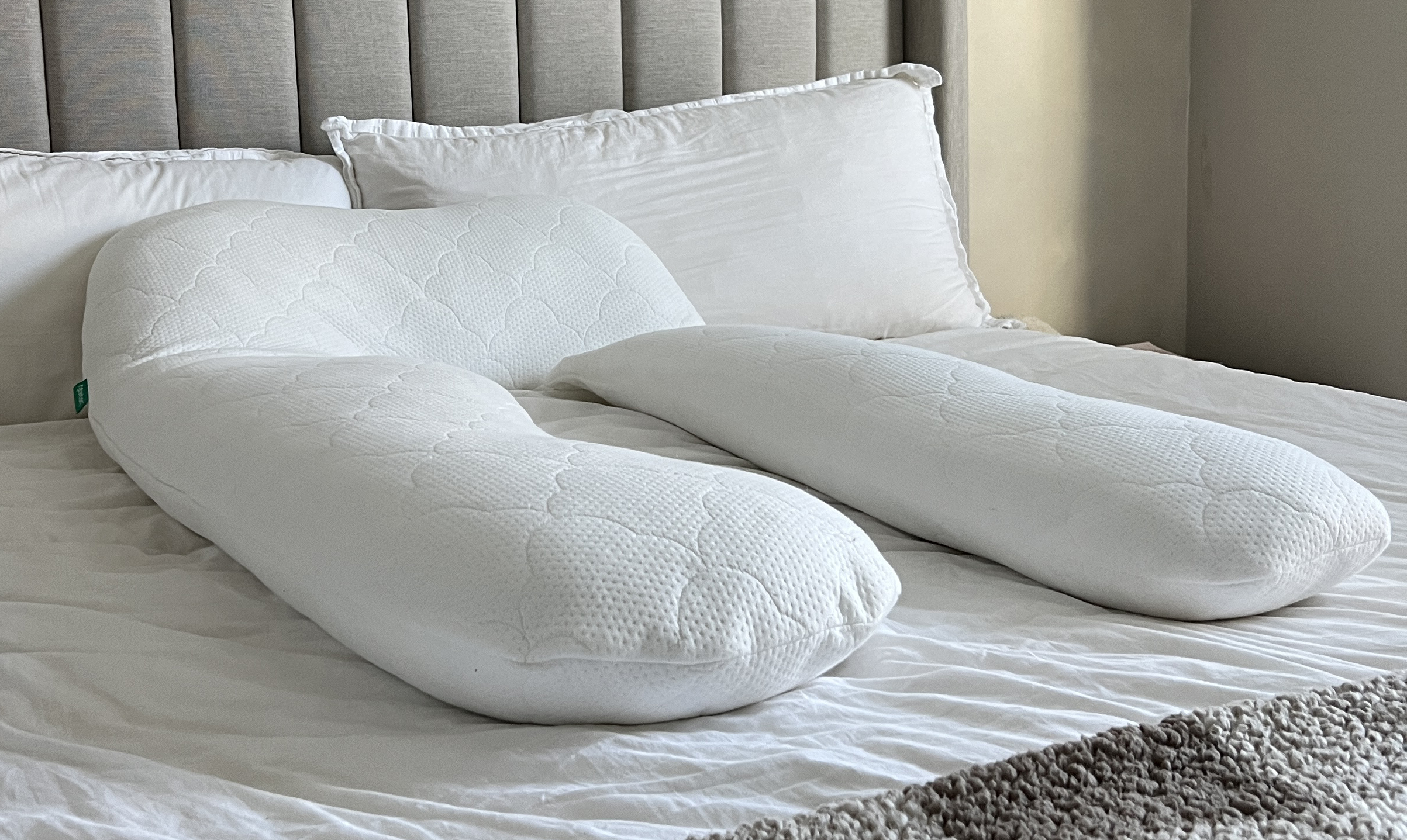 The Newton Pillow laid out on a made bed