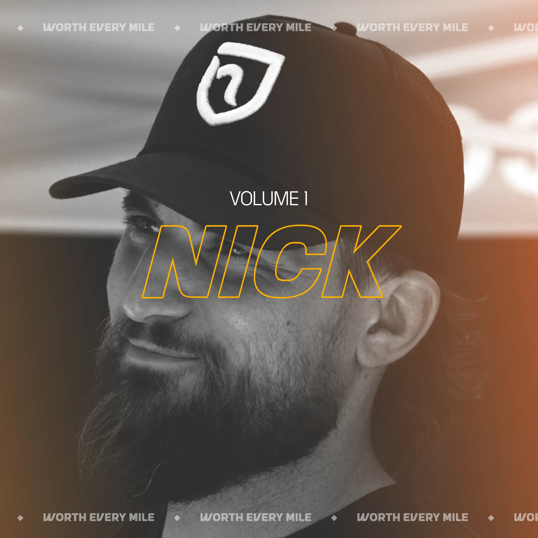 A black and white photo of a bearded man in a cap, with the text 'Volume 1 Nick'.