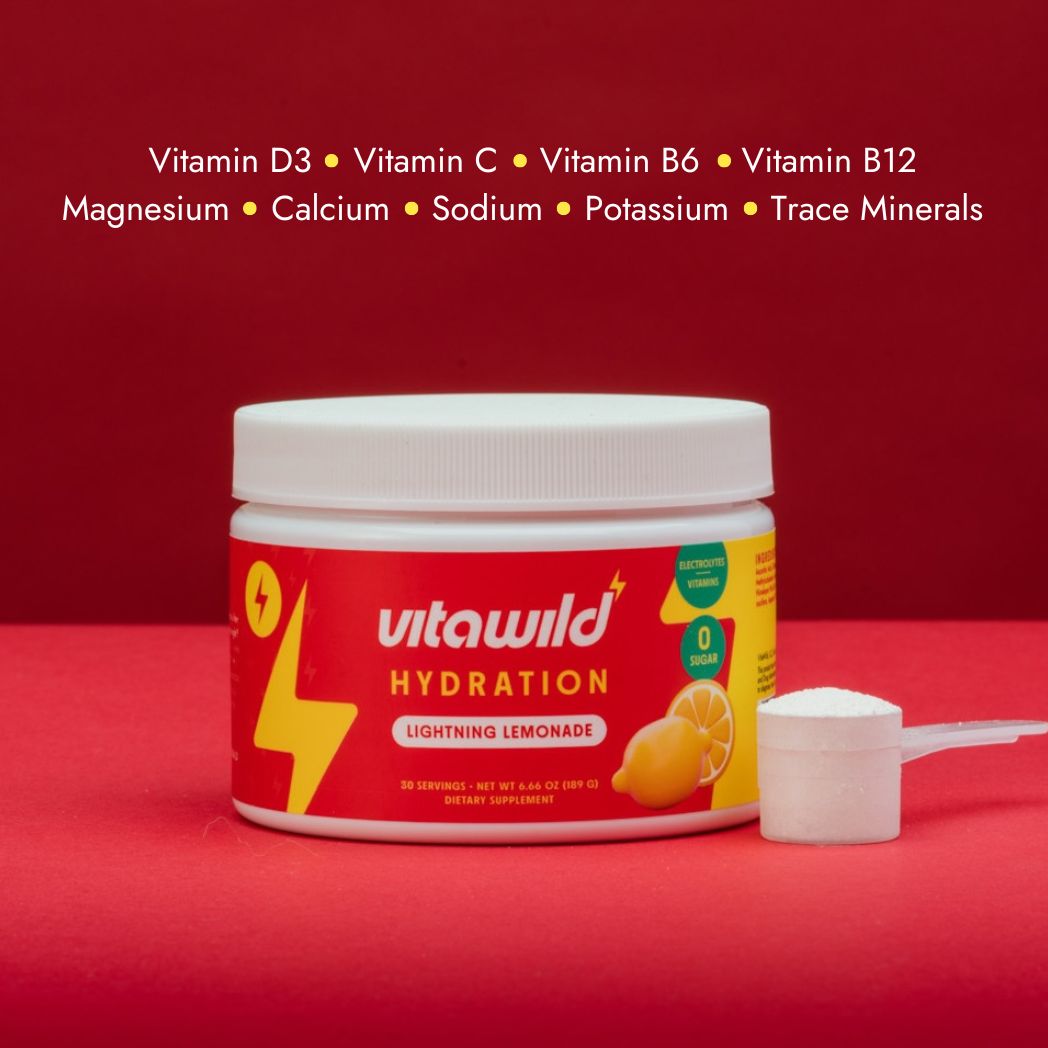 Container of Vitawild Hydration Lightning Lemonade with a scoop on a red background.