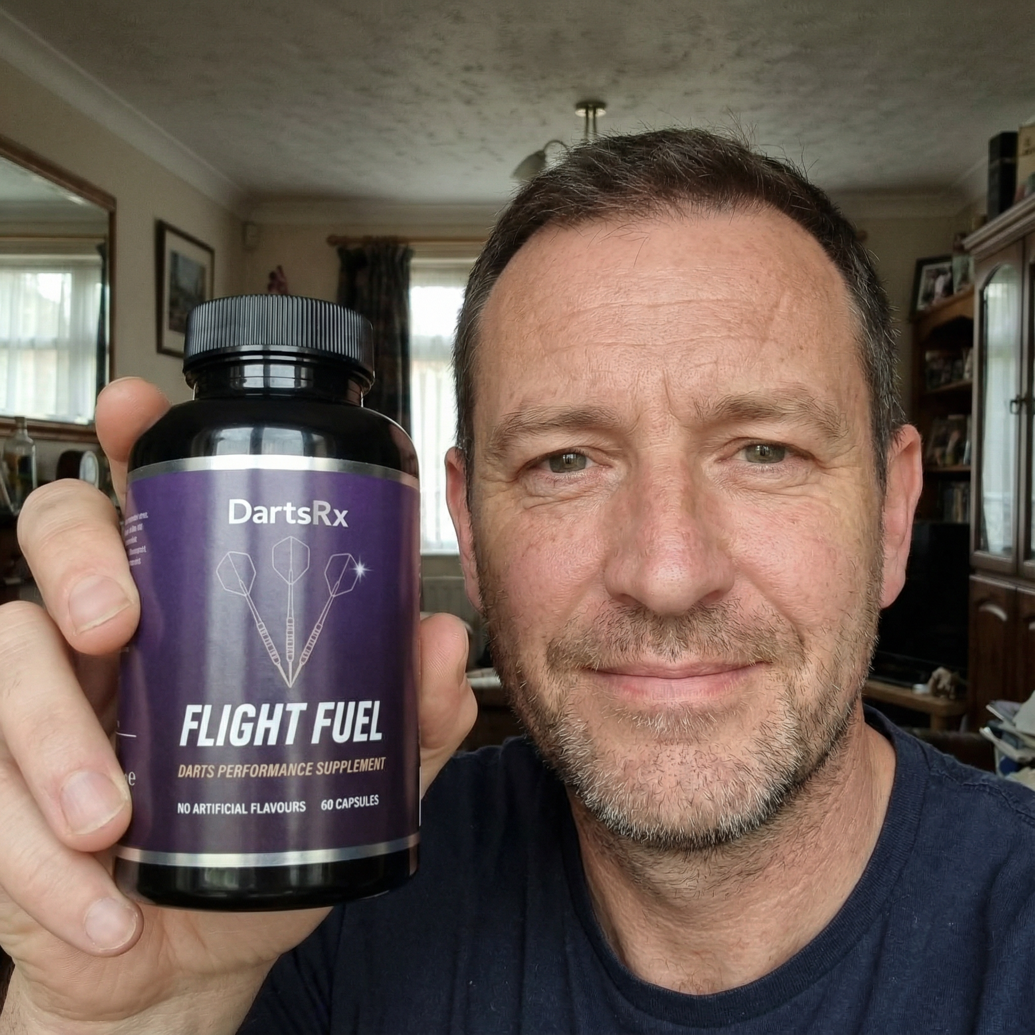 Person holding a bottle labeled 'Flight Fuel' darts performance supplement.