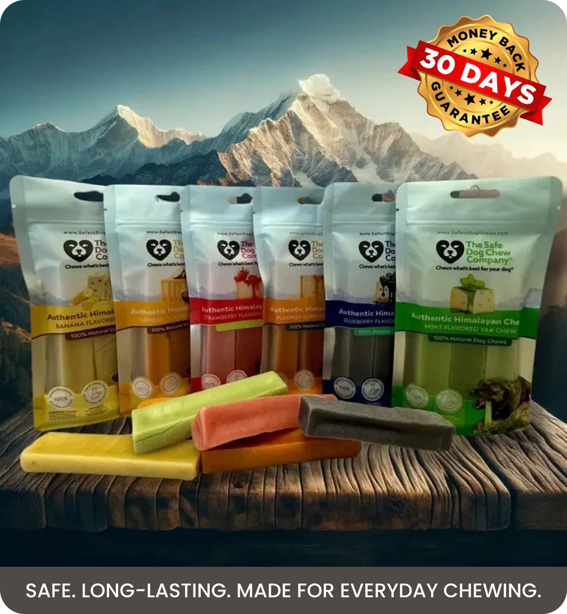Various flavors of The Safe Dog Chew Company dog chews displayed on a wooden surface with mountains behind.