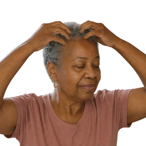 An older woman with short gray hair massages her scalp with both hands and her eyes closed.