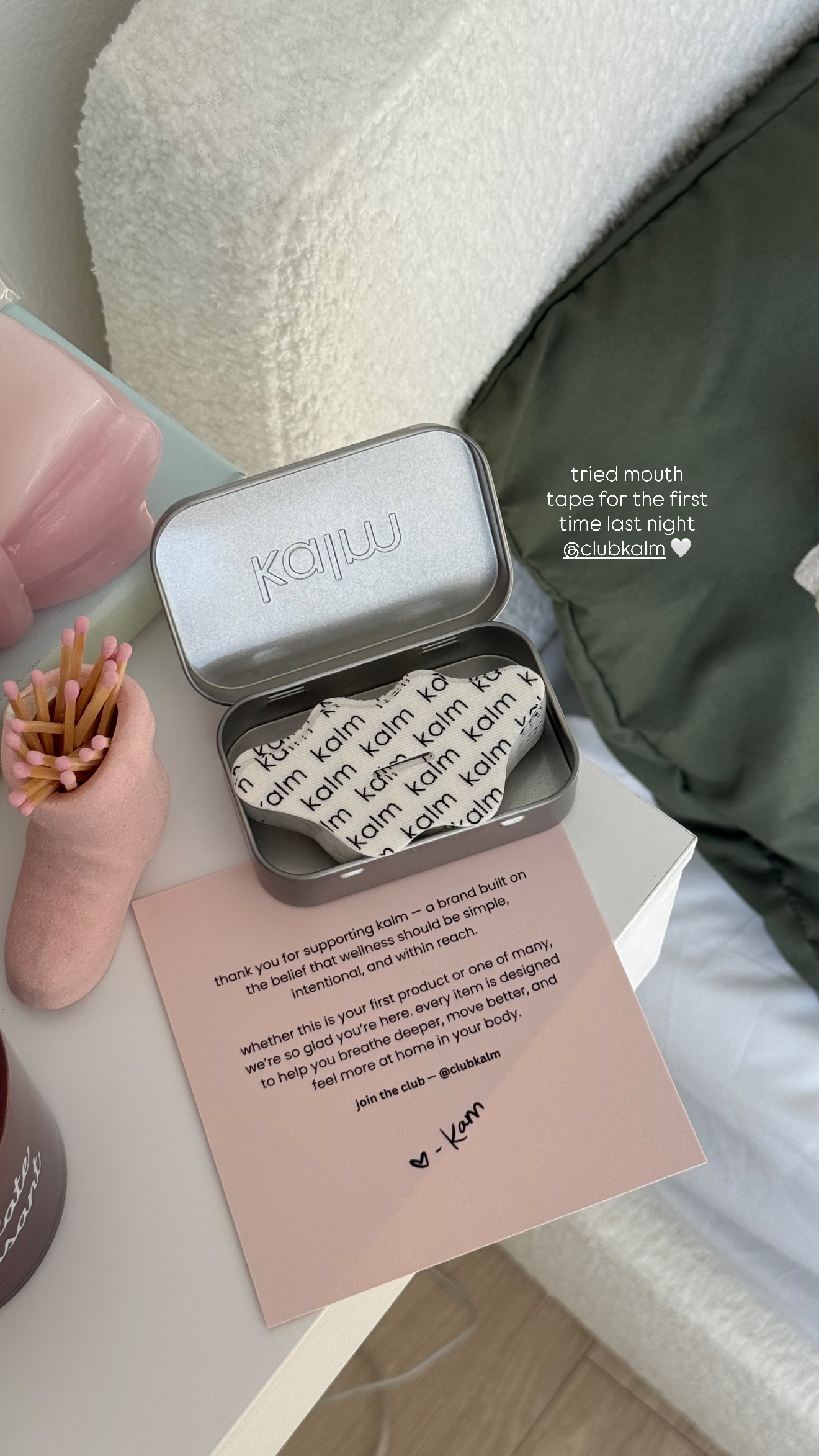 An open tin of 'kalm' mouth tape sits on a table next to a thank you card.