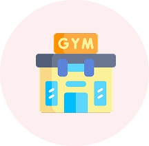 A colorful cartoon icon of a gym building with a sign that says 'GYM', inside a red circle.