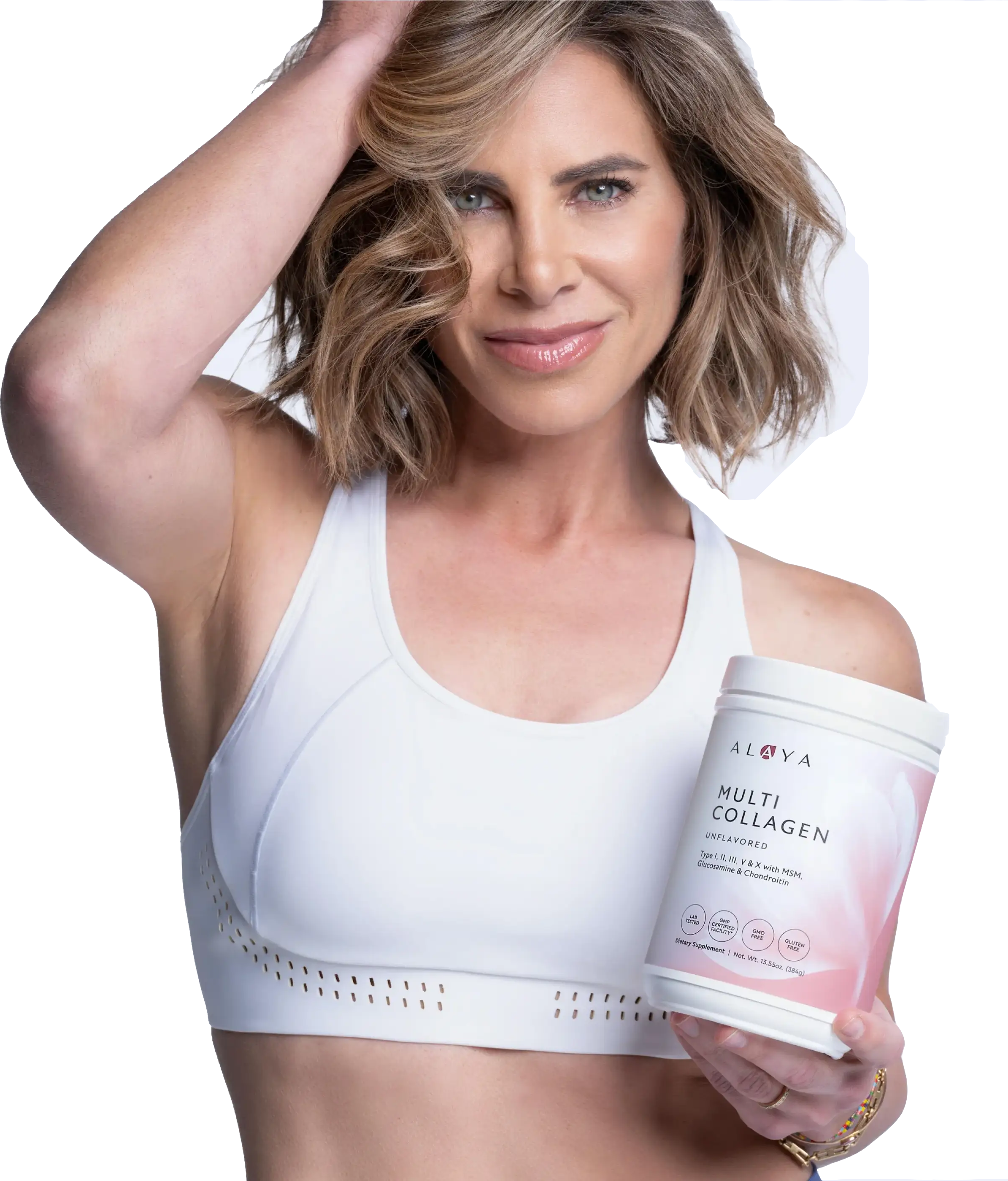 A woman in a white sports bra holds a container of Alaya Multi Collagen while smiling at the camera.