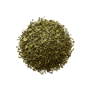 A circular pile of loose, dried green tea leaves against a white background.