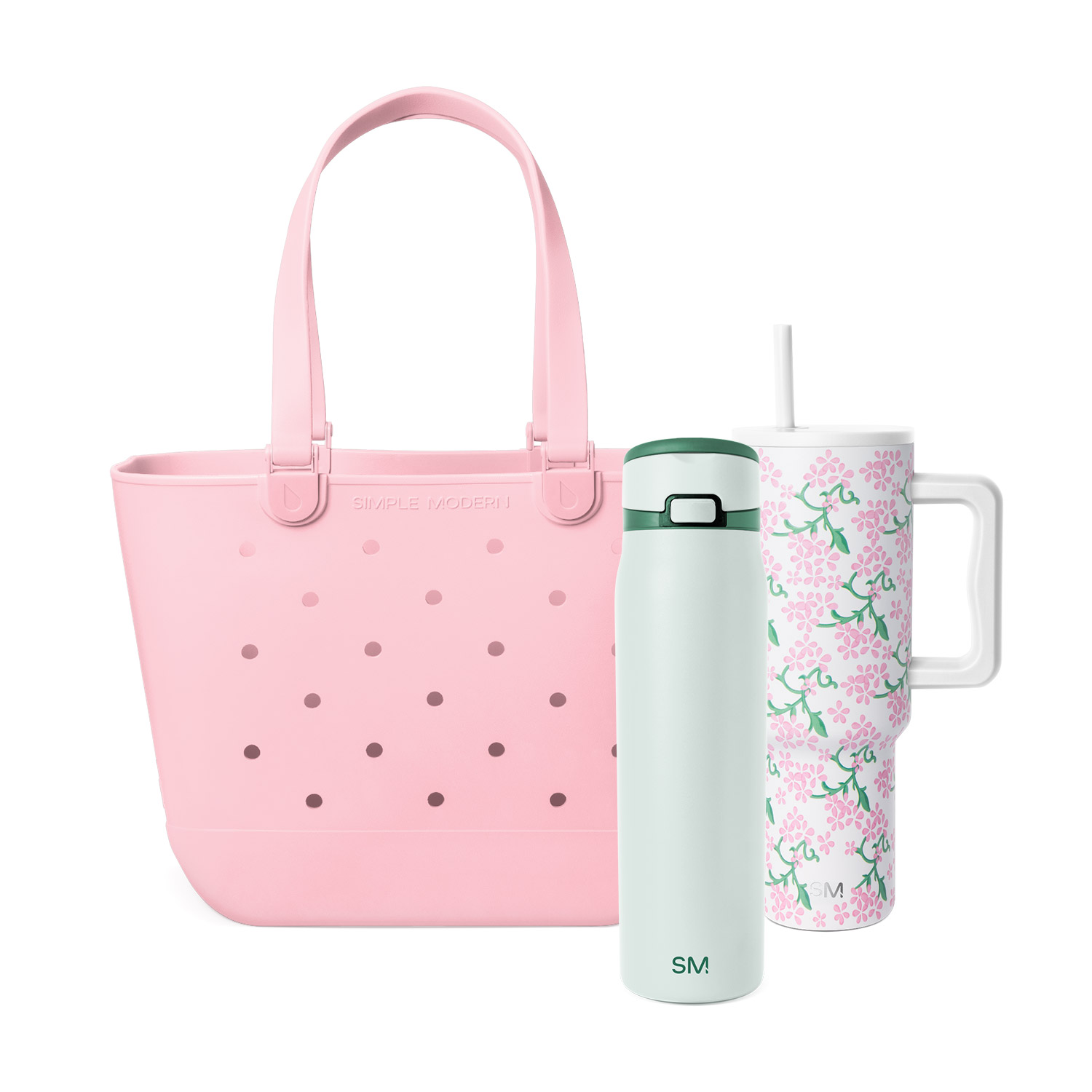 A pink tote bag, a mint green water bottle, and a white floral tumbler against a white background.
