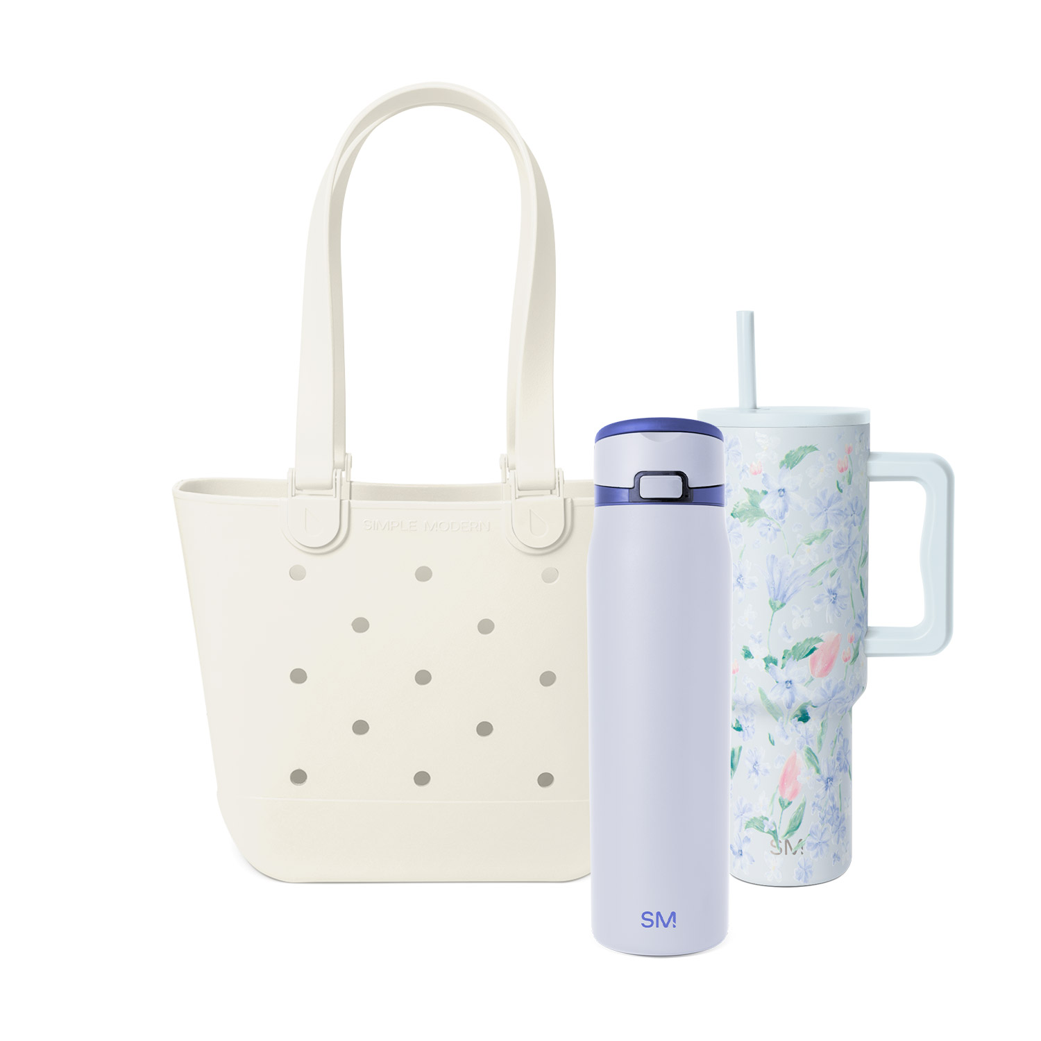 A cream tote bag, a lavender water bottle, and a floral tumbler with a handle and straw.