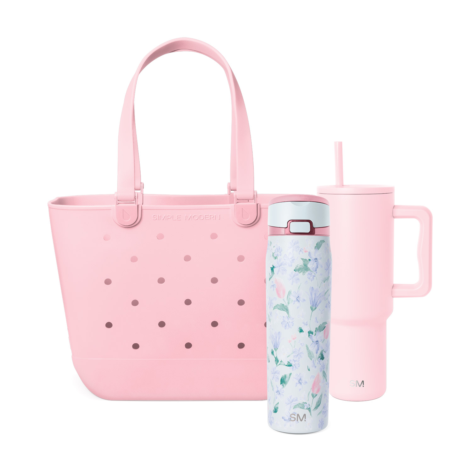 A pink tote bag, a pink tumbler with a straw, and a floral insulated water bottle.
