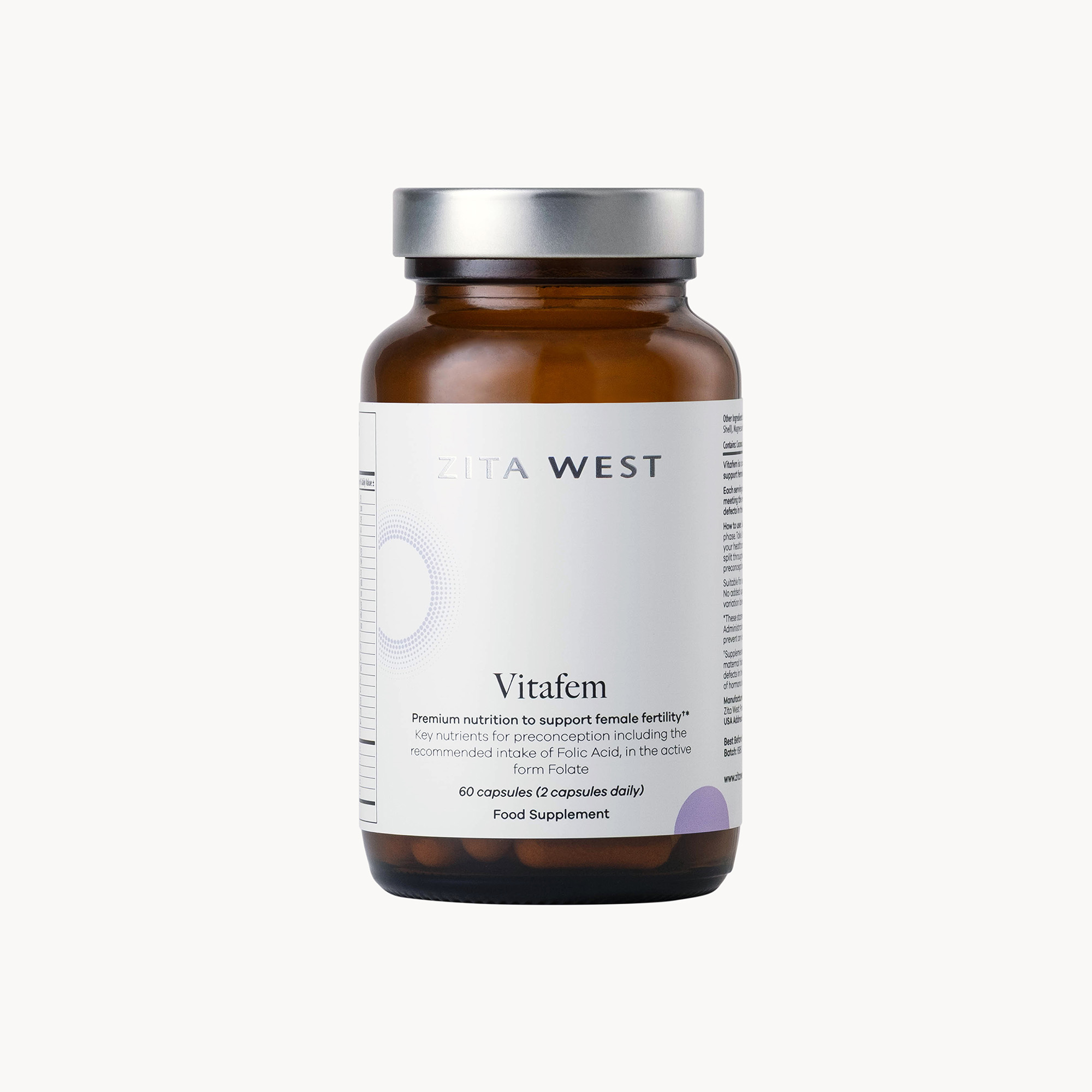 A brown glass bottle of Zita West Vitafem food supplement against a white background.