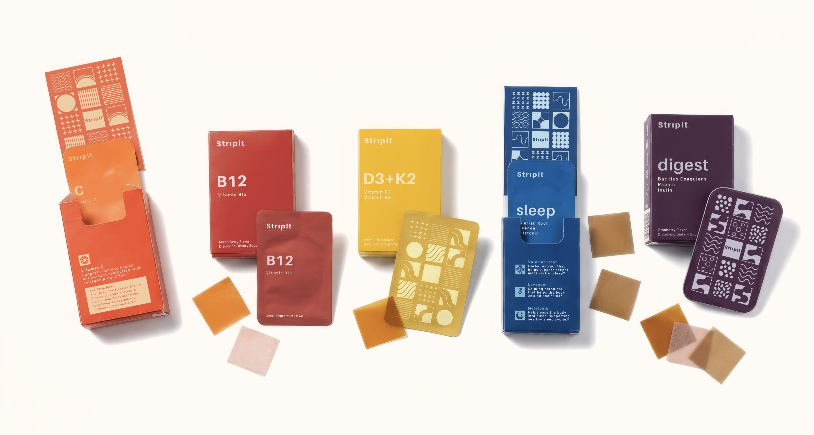 A variety of colorful Striplt vitamin supplement boxes and their dissolvable strips arranged on a white surface.