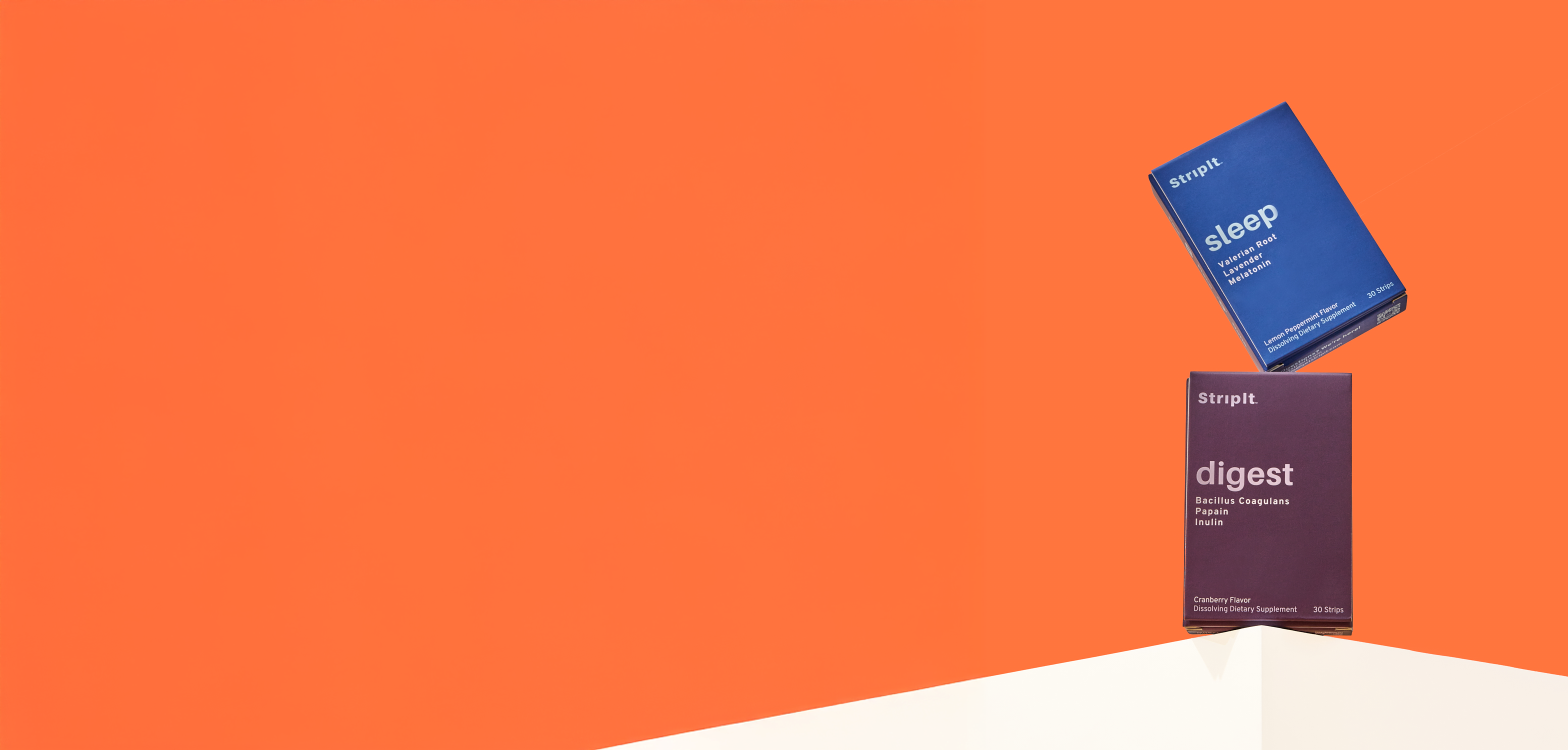 Two boxes of StripIt supplements, Sleep and Digest, balanced on a white surface against an orange background.