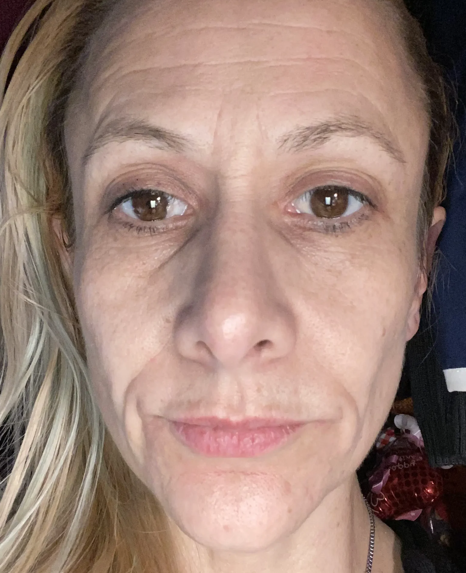 Close-up of a person's face with neutral expression.